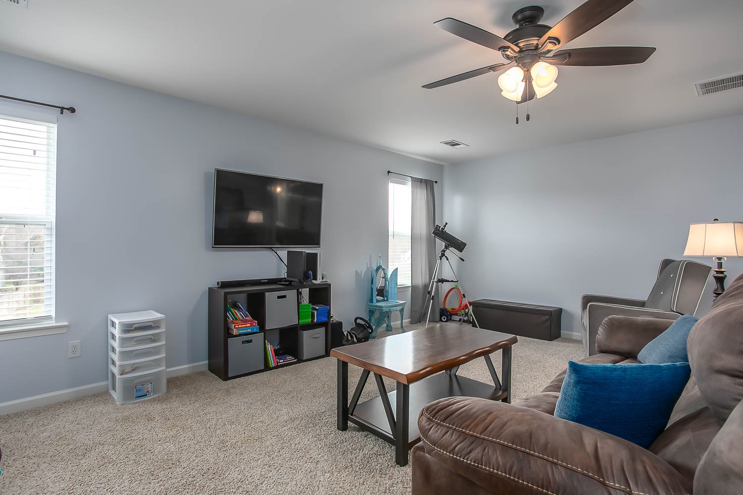 1715 Emma Circle Spring Hill, TN 37174 - Photo 15 of 17 a living room with furniture and a flat screen tv