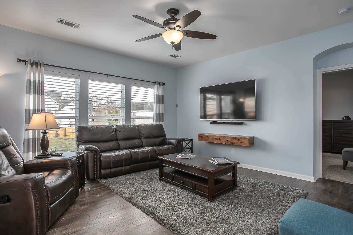 1715 Emma Circle Spring Hill, TN 37174 - Photo 3 of 17 a living room with furniture and a flat screen tv