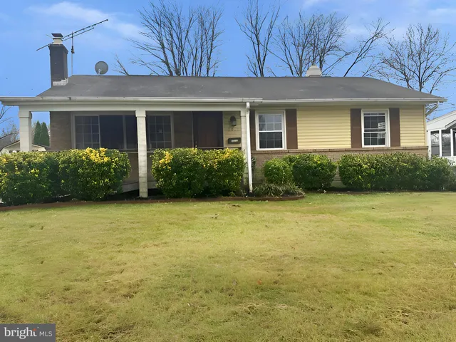 a view of a house with garden and yard