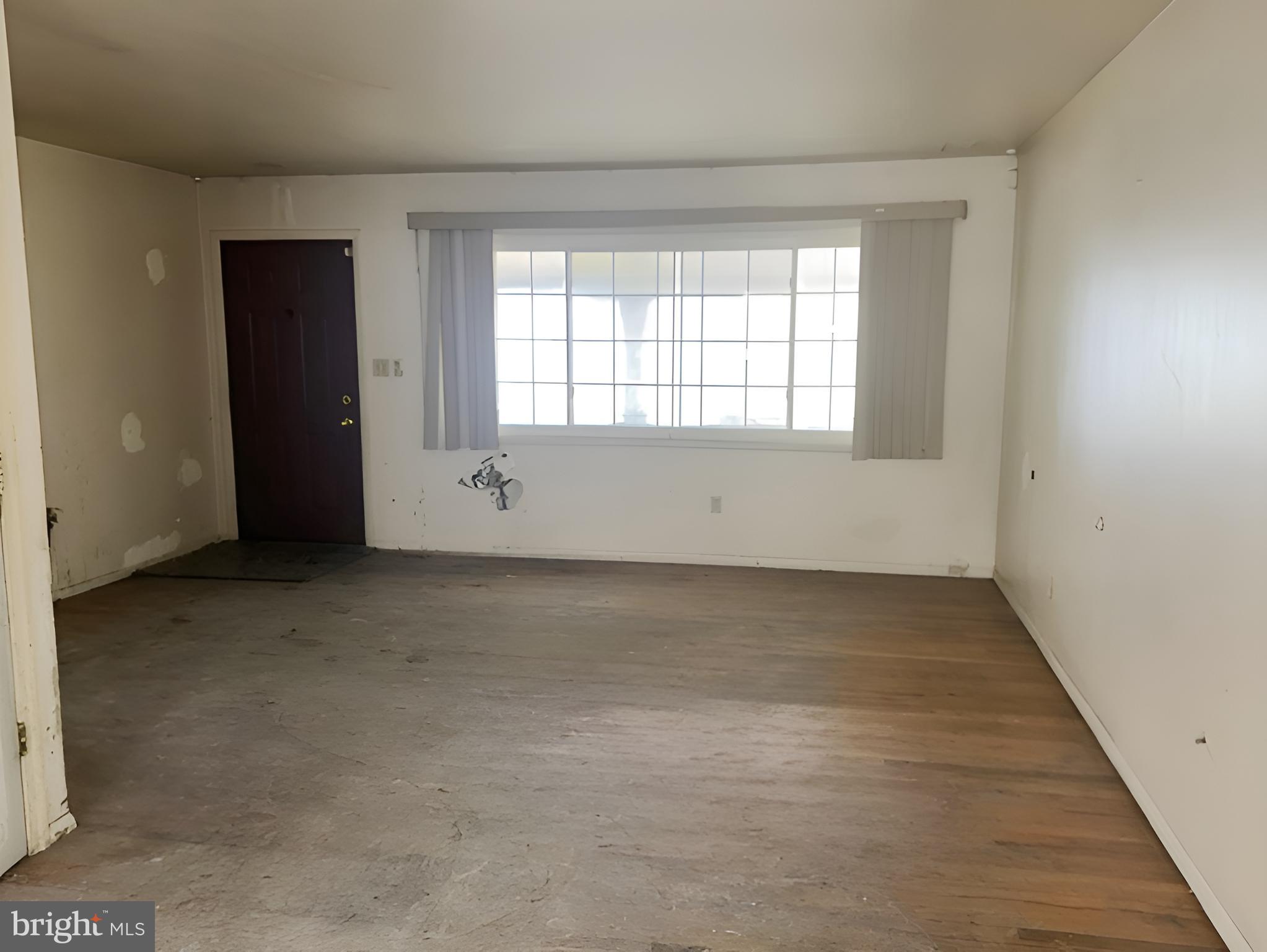 1921 Harewood Road Edgewood, MD 21040 - Photo 12 of 25 an empty room with wooden floor and windows