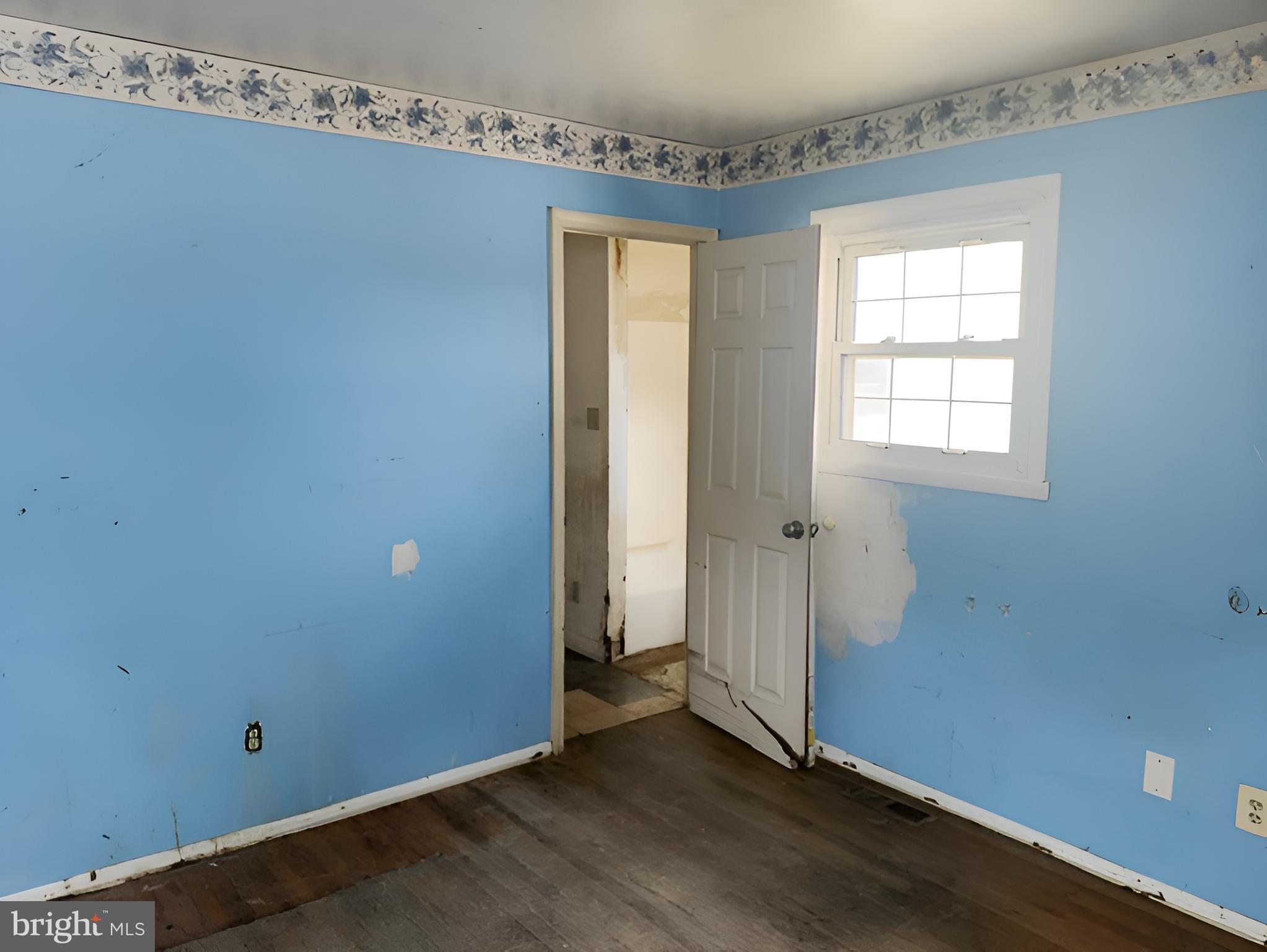 1921 Harewood Road Edgewood, MD 21040 - Photo 16 of 25 an empty room with wooden floor and windows