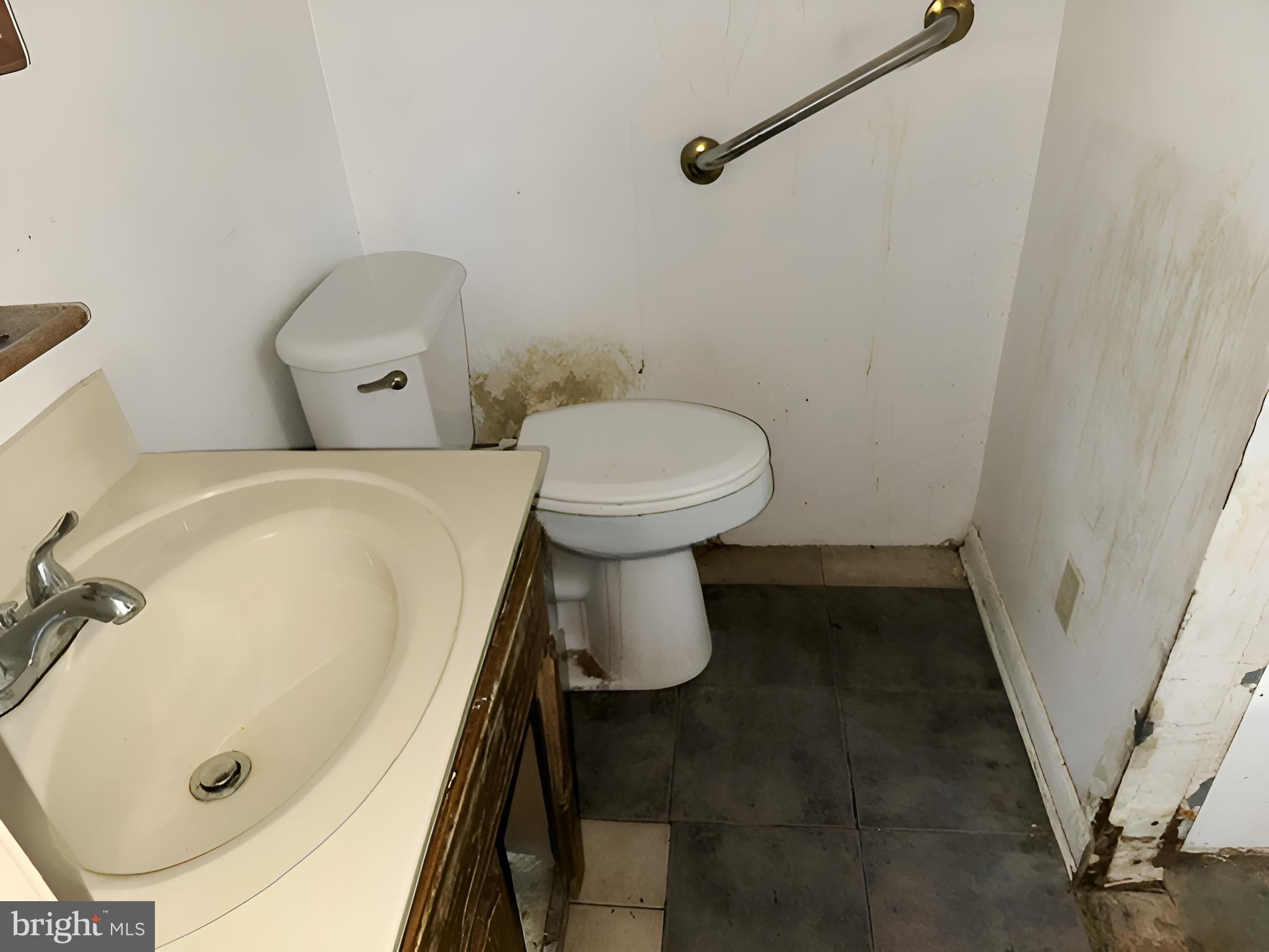 1921 Harewood Road Edgewood, MD 21040 - Photo 18 of 25 a bathroom with a tub and toilet