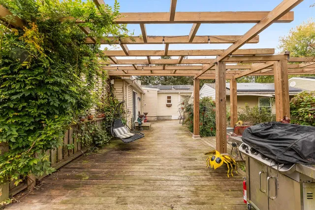a view of a backyard with sitting area