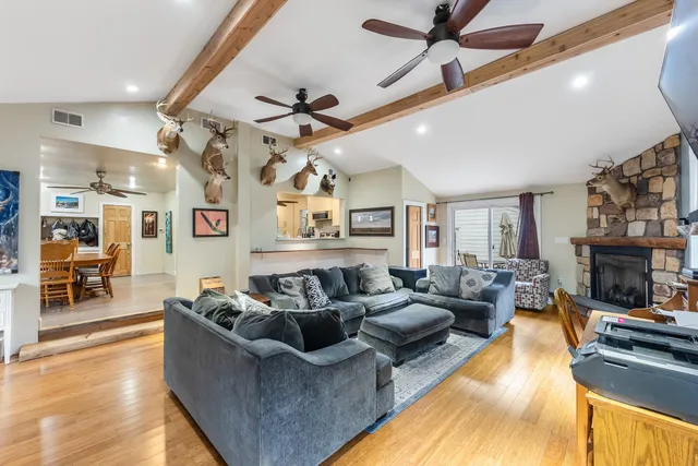 a living room with furniture and a fireplace