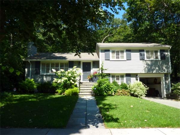 170 Middlesex Road Chestnut Hill, MA 02467 - Photo 1 of 7 a front view of a house with a yard and potted plants