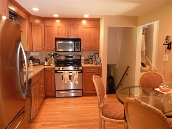 170 Middlesex Road Chestnut Hill, MA 02467 - Photo 2 of 7 a kitchen with stainless steel appliances a stove top oven a sink and a refrigerator
