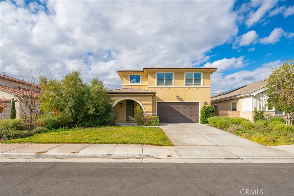30455 Stage Coach Road Menifee, CA 92584 - Photo 1 of 1 a front view of a house with a yard garage and garage