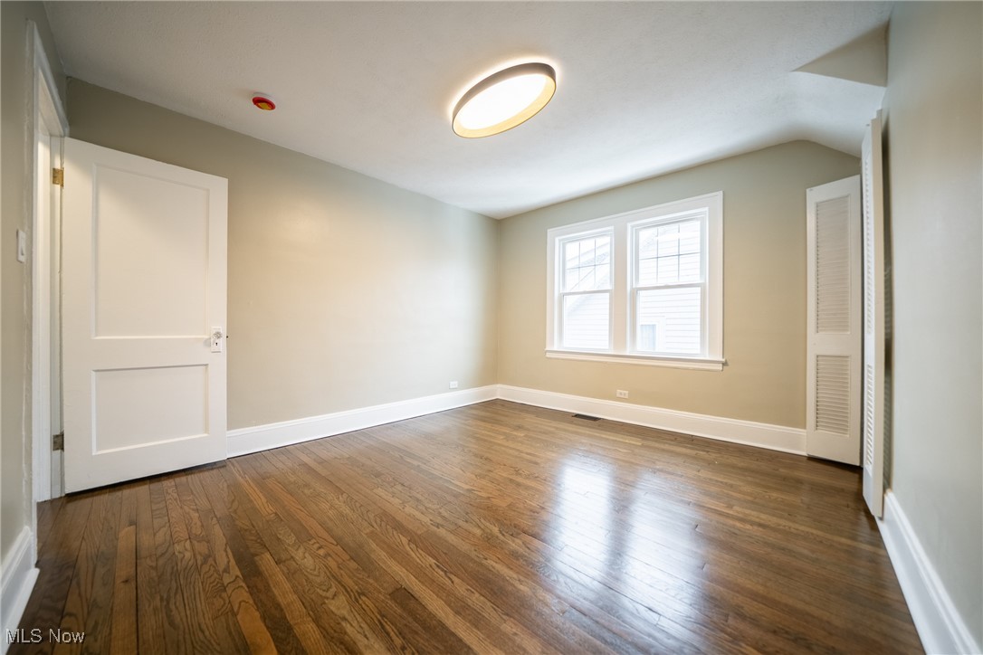 3816 Summit Park Road Cleveland Heights, OH 44121 - Photo 17 of 35 Unfurnished room featuring dark wood-style flooring and baseboards