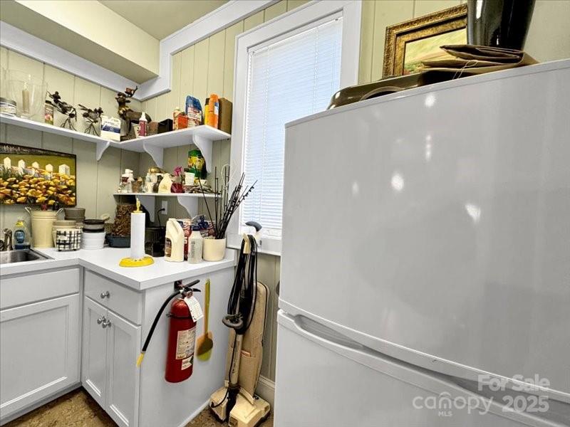 116 Dana Road Waynesville, NC 28786 - Photo 15 of 42 a utility room with cabinets washer and dryer