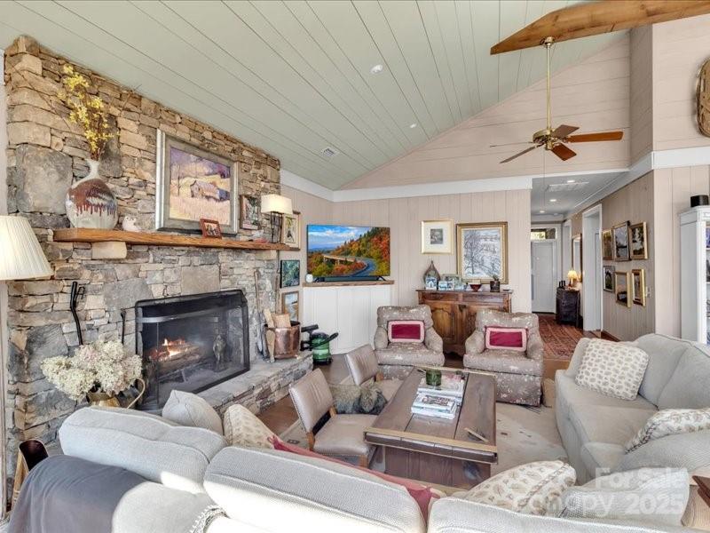 116 Dana Road Waynesville, NC 28786 - Photo 2 of 42 a living room with furniture and a fireplace