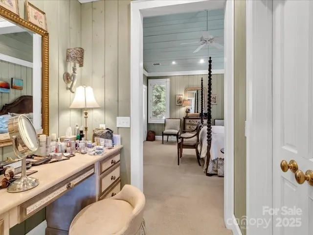 a en suite bathroom with a toilet sink and mirror
