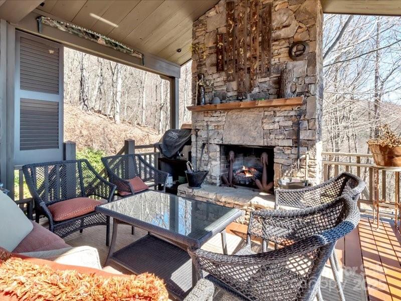116 Dana Road Waynesville, NC 28786 - Photo 24 of 42 a living room with furniture and a fireplace