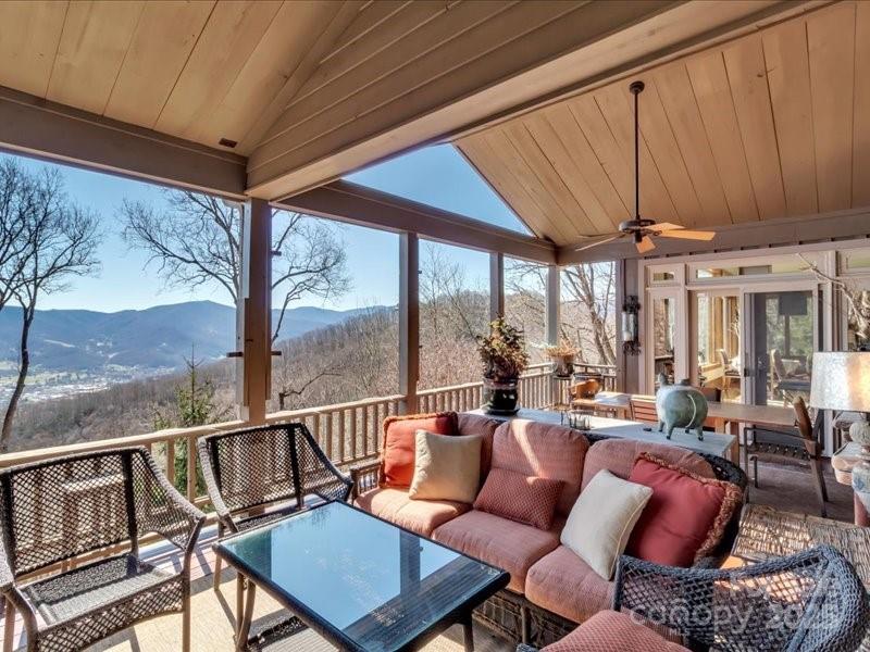 116 Dana Road Waynesville, NC 28786 - Photo 25 of 42 a balcony with furniture and a potted plant