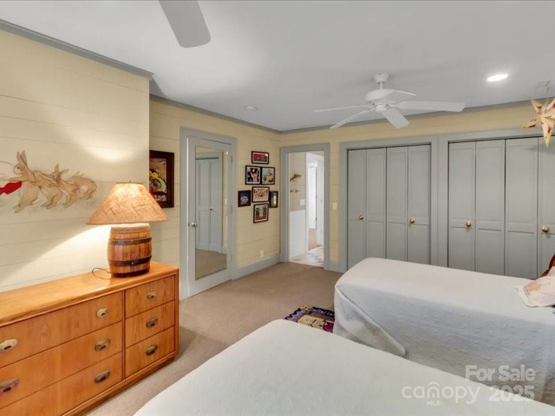 116 Dana Road Waynesville, NC 28786 - Photo 27 of 42 a bedroom with a large bed and a dresser