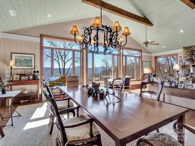 a view of a dining room with furniture window and outside view