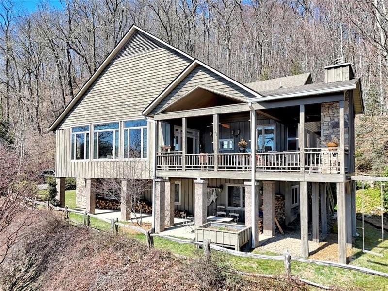 116 Dana Road Waynesville, NC 28786 - Photo 4 of 42 a front view of a house with garden