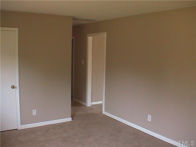 709 Rippling Stream Road Durham, NC 27704 - Photo 5 of 10 Different view of living room looking towards the hall way and entrance to family room. Living Room