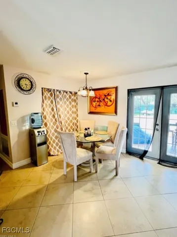 a view of a livingroom with furniture and a window