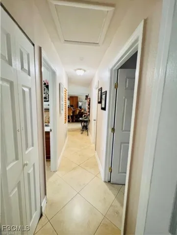 a view of livingroom with furniture and a hallway