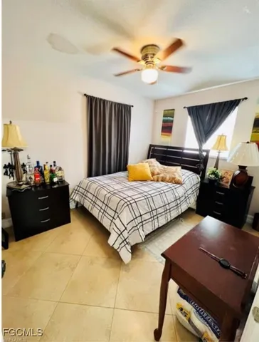 a bedroom with a bed and dresser