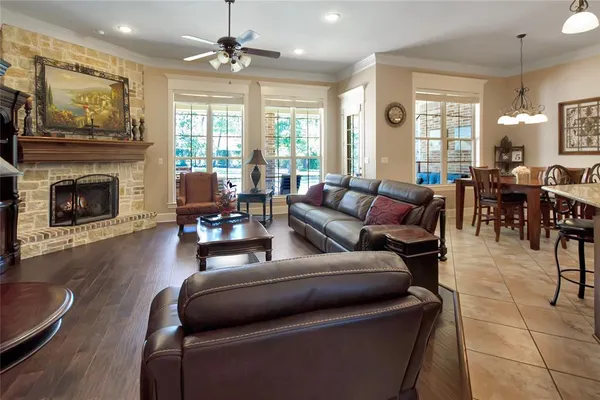 a living room with furniture fireplace and window