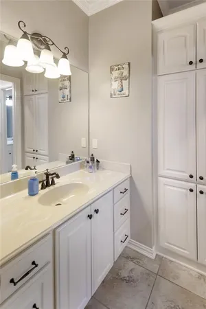 a bathroom with a double vanity sink mirror and