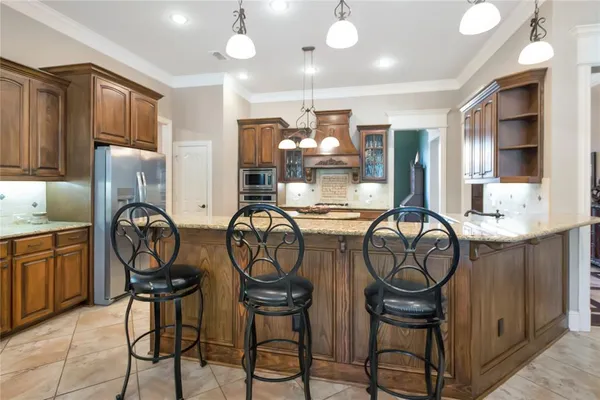 a view of dining room with furniture and chandelier