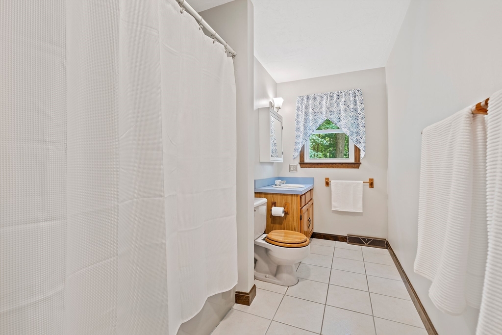 7 Josephine Street Canton, MA 02021 - Photo 15 of 30 a white toilet sitting next to a window