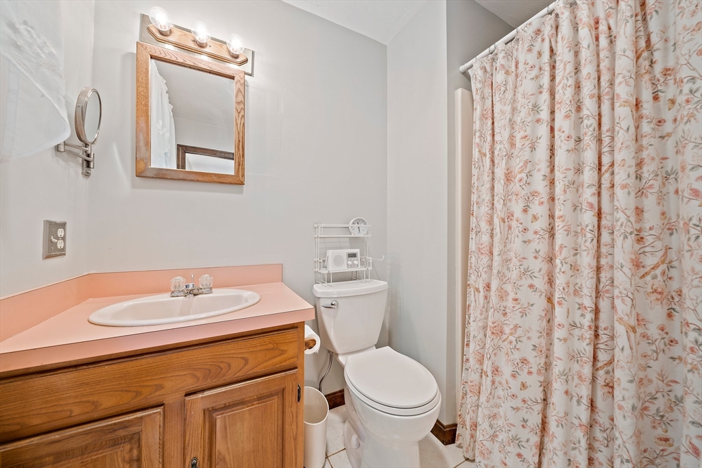 7 Josephine Street Canton, MA 02021 - Photo 19 of 30 a bathroom with a sink toilet and vanity