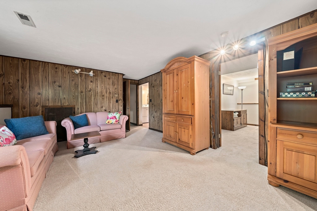 7 Josephine Street Canton, MA 02021 - Photo 25 of 30 a living room with furniture and a flat screen tv