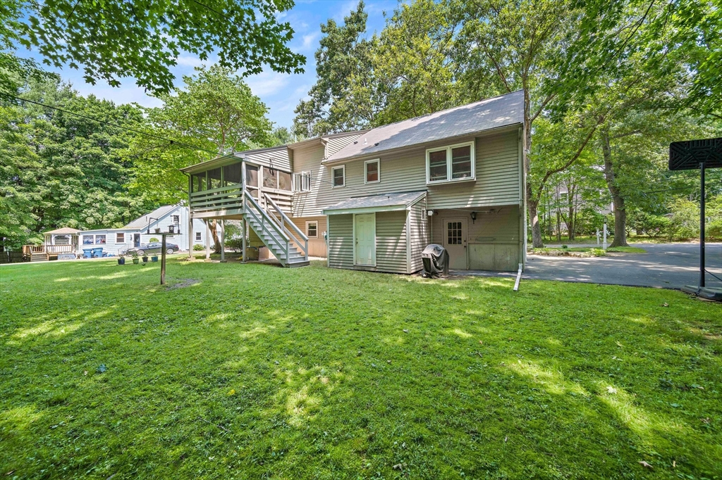 7 Josephine Street Canton, MA 02021 - Photo 29 of 30 a view of a house with backyard and a tree