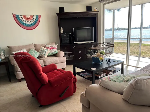 a bedroom with furniture and a book shelf