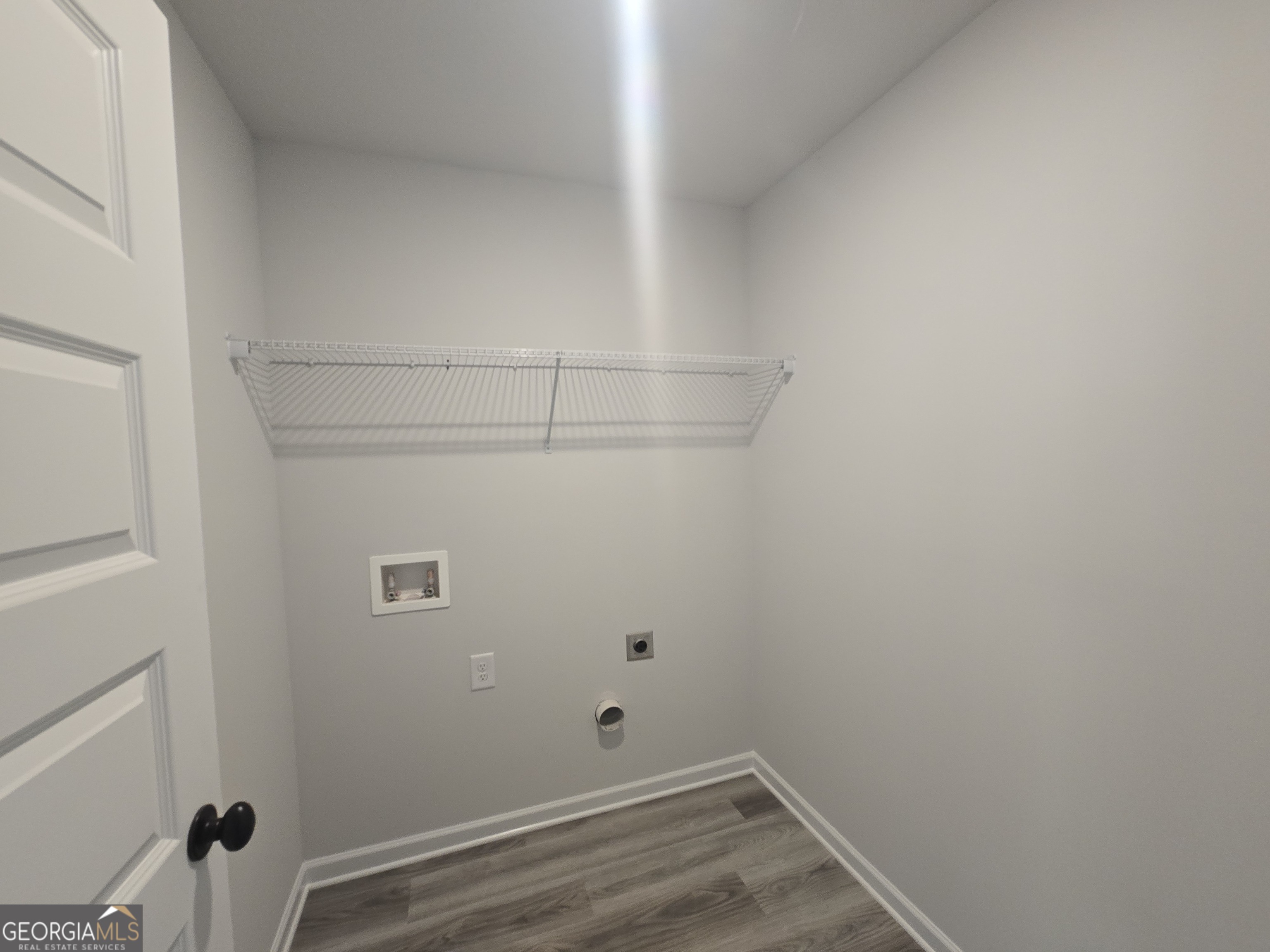 51 Champions Lane, Unit 2 Winder, GA 30680 - Photo 13 of 16 a view of a room with racks on the wall