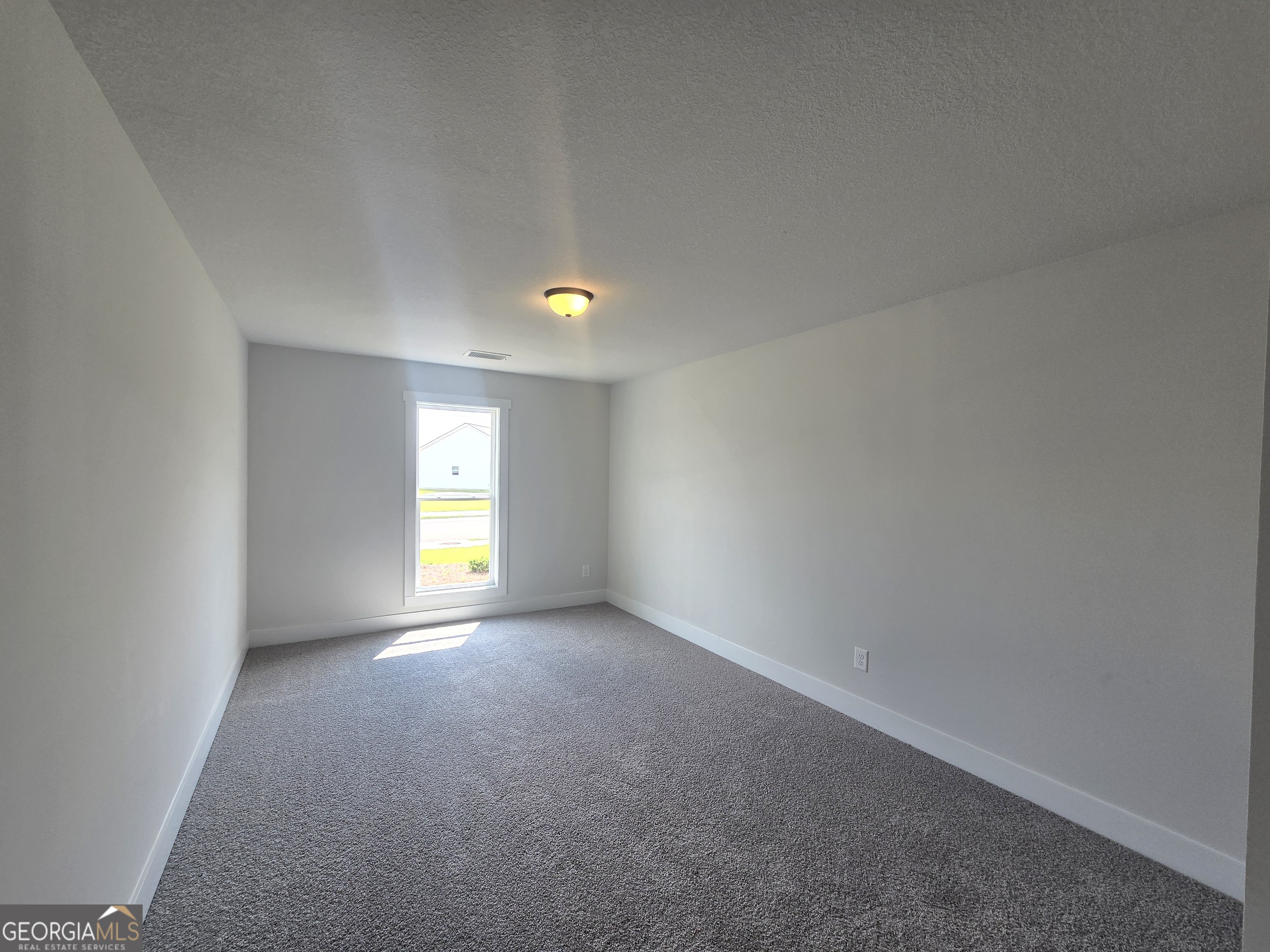 51 Champions Lane, Unit 2 Winder, GA 30680 - Photo 8 of 16 a view of empty room with window