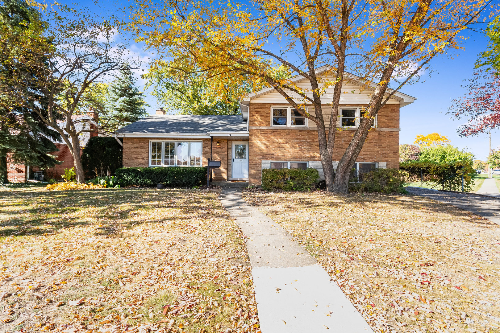 a view of a house with a snow in the yard
