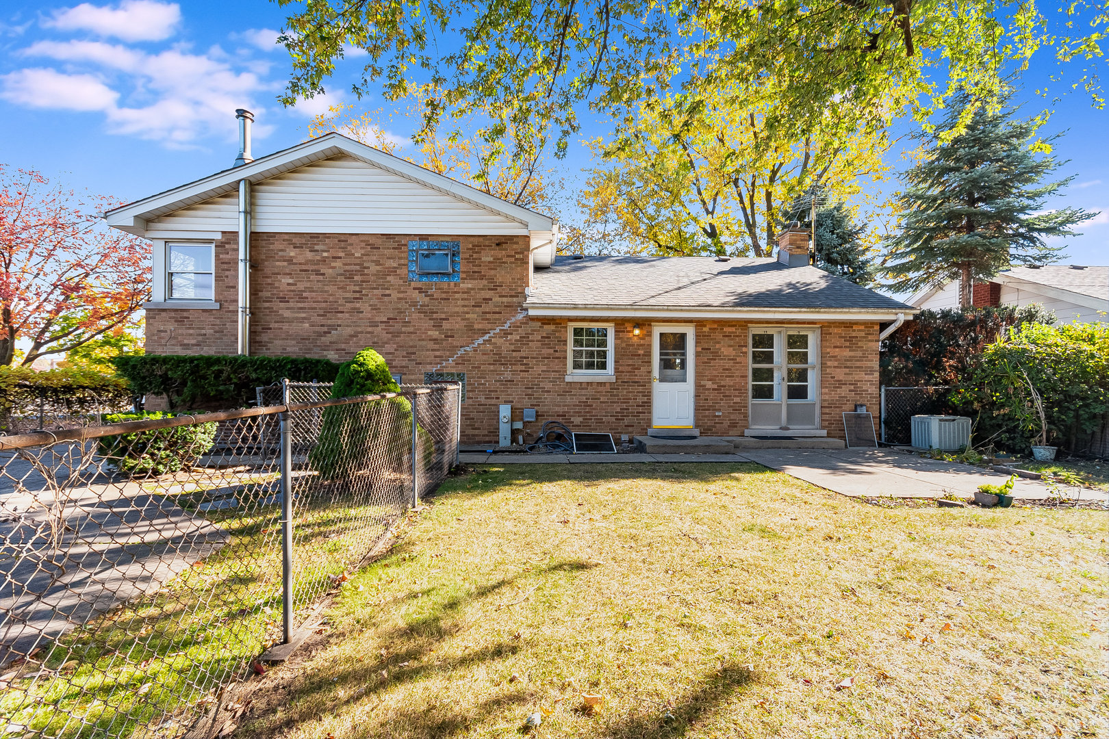 8 South Mt Prospect Road Mount Prospect, IL 60056 - Photo 20 of 25 a front view of a house with a yard