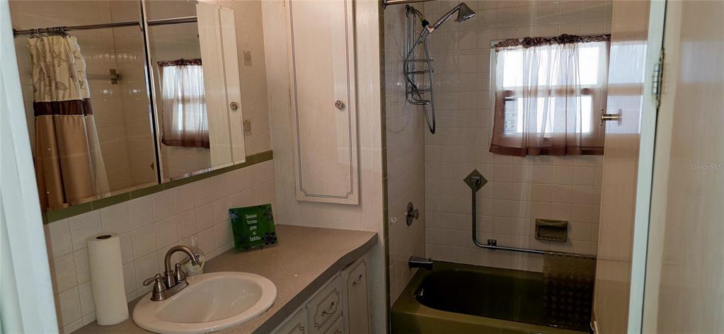 2331 Belleair Road, Unit 806 Clearwater, FL 33764 - Photo 14 of 23 a bathroom with a sink a toilet and shower