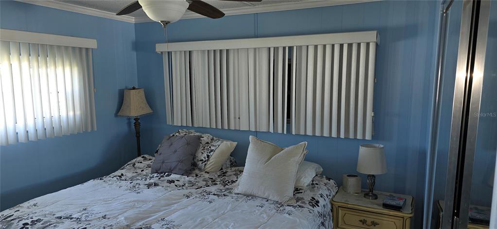 2331 Belleair Road, Unit 806 Clearwater, FL 33764 - Photo 15 of 23 a bed sitting in a bedroom next to a window