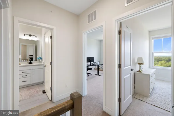 a large bed sitting in a bedroom and table