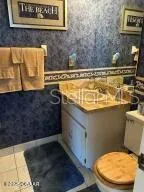 a bathroom with a toilet and a sink