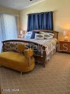 a bed sitting in a room next to a window