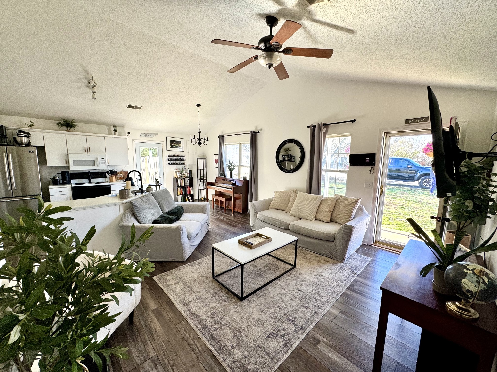 2747 Windwalker Court Murfreesboro, TN 37128 - Photo 2 of 15 a living room with furniture kitchen view and a chandelier