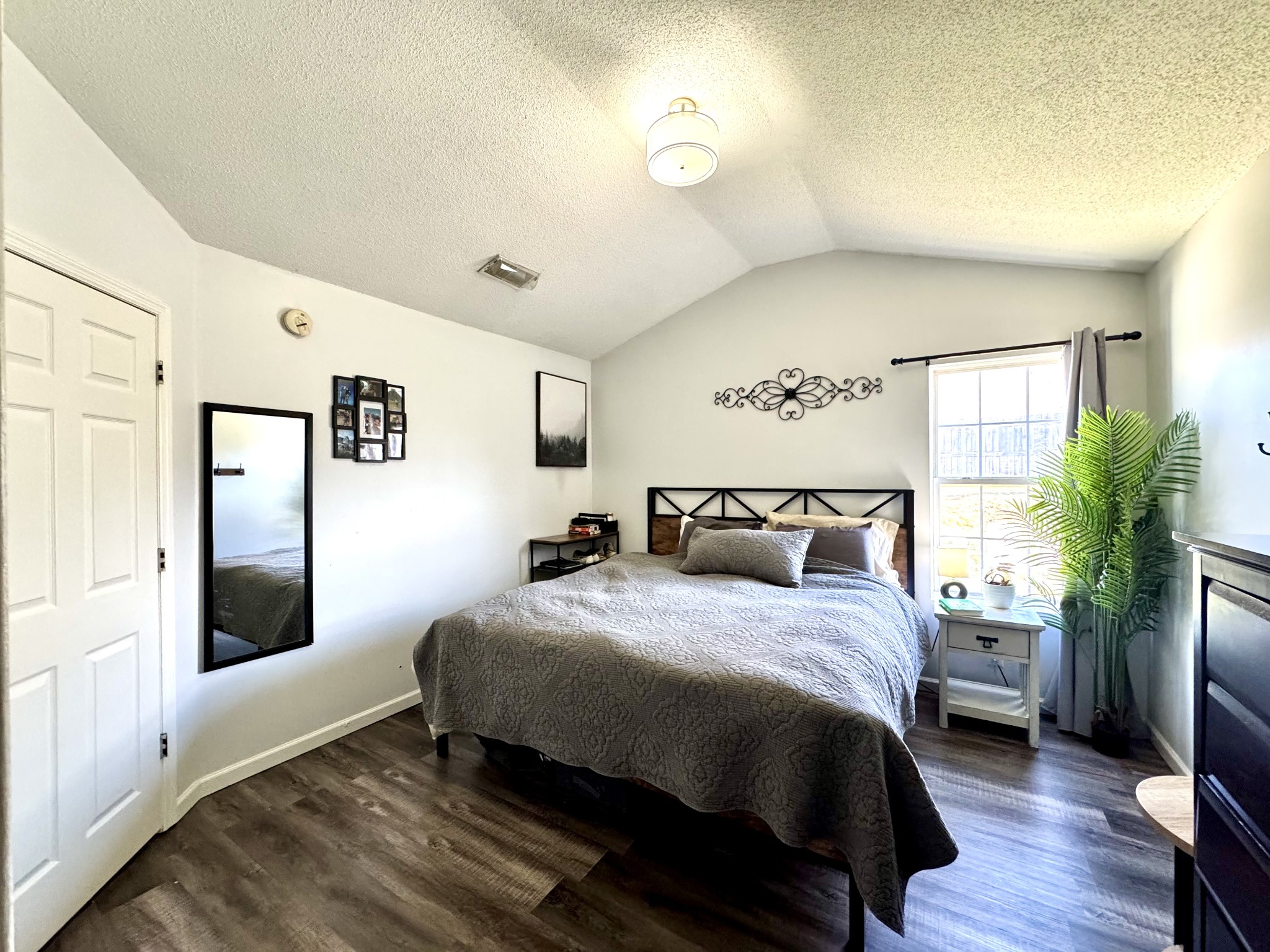 2747 Windwalker Court Murfreesboro, TN 37128 - Photo 8 of 15 a bedroom with a large bed and a potted plant