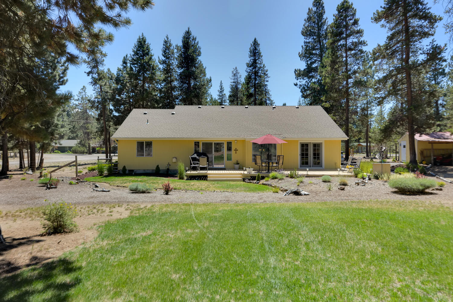 52311 Ammon Road La Pine, OR 97739 - Photo 33 of 39 a view of house with backyard and seating space