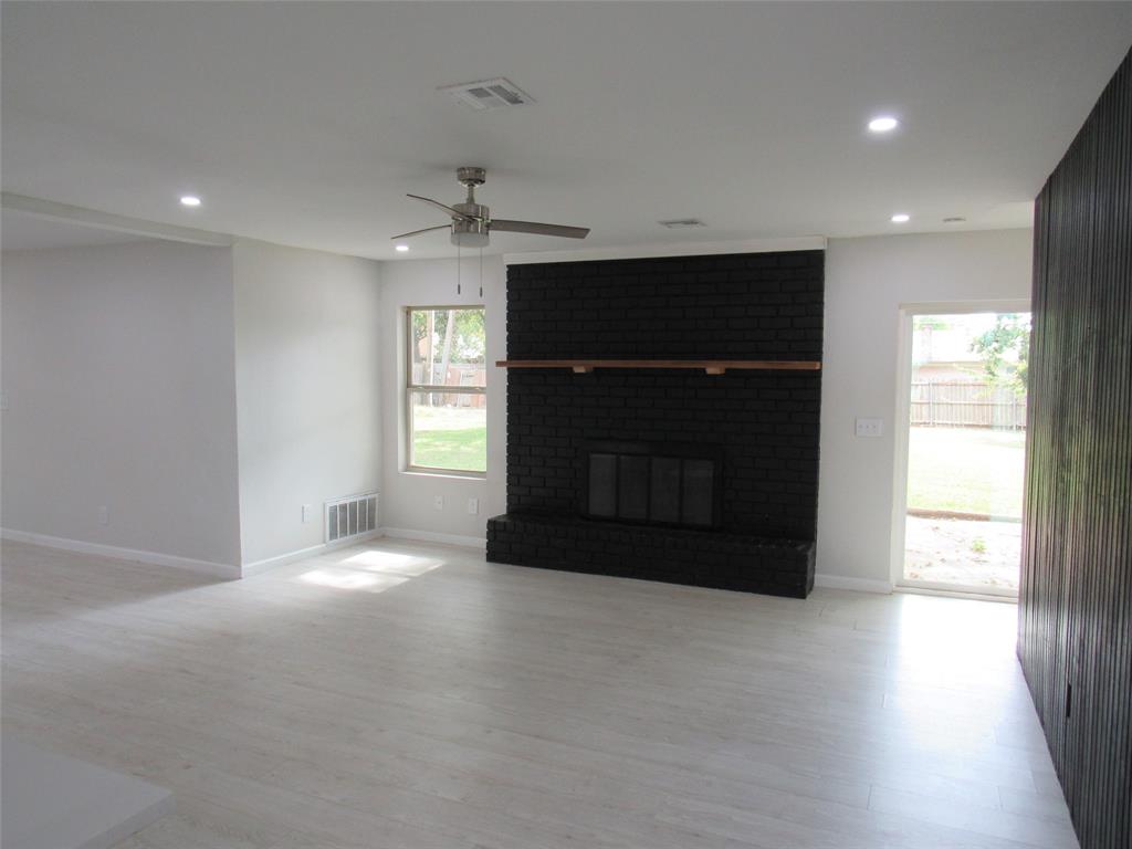 321 Crescent Drive Hewitt, TX 76643 - Photo 2 of 21 a living room with a fireplace and a window