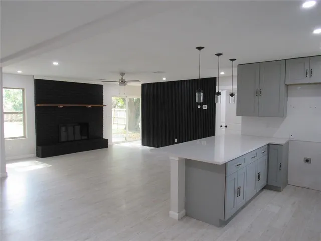 a kitchen with stainless steel appliances a refrigerator and a microwave