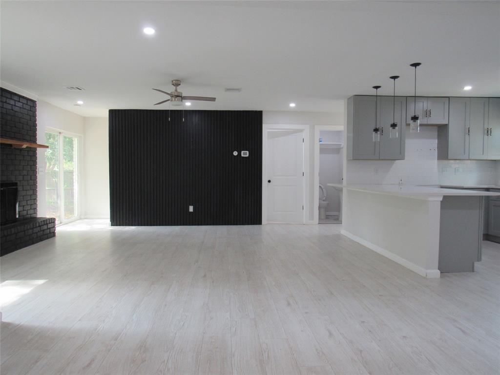 321 Crescent Drive Hewitt, TX 76643 - Photo 4 of 21 a view of a kitchen with a sink and a refrigerator