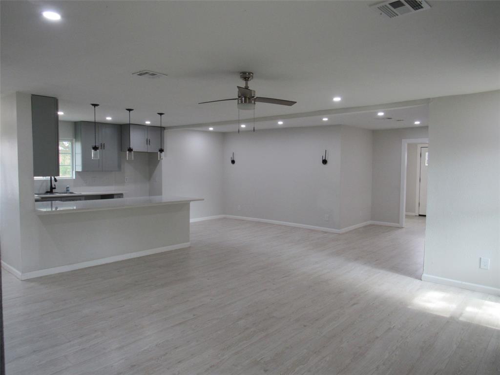 321 Crescent Drive Hewitt, TX 76643 - Photo 5 of 21 an open space with kitchen view and a refrigerator