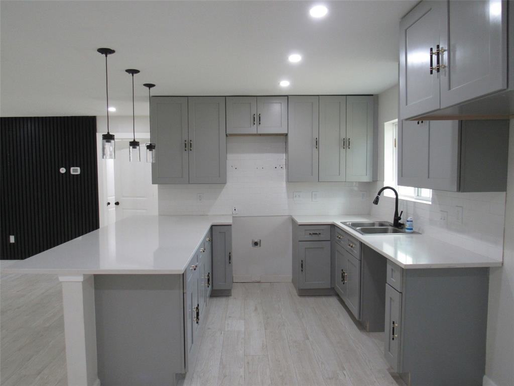321 Crescent Drive Hewitt, TX 76643 - Photo 8 of 21 a kitchen with a sink stove and refrigerator