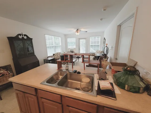 a room with furniture a rug and a window